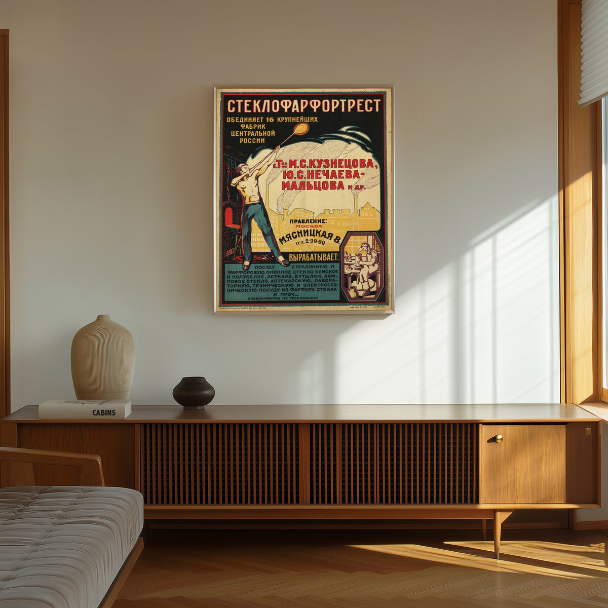 Framed art print of Steklofarfortrest, in a thin light frame on a sunlit wall above a wooden sideboard