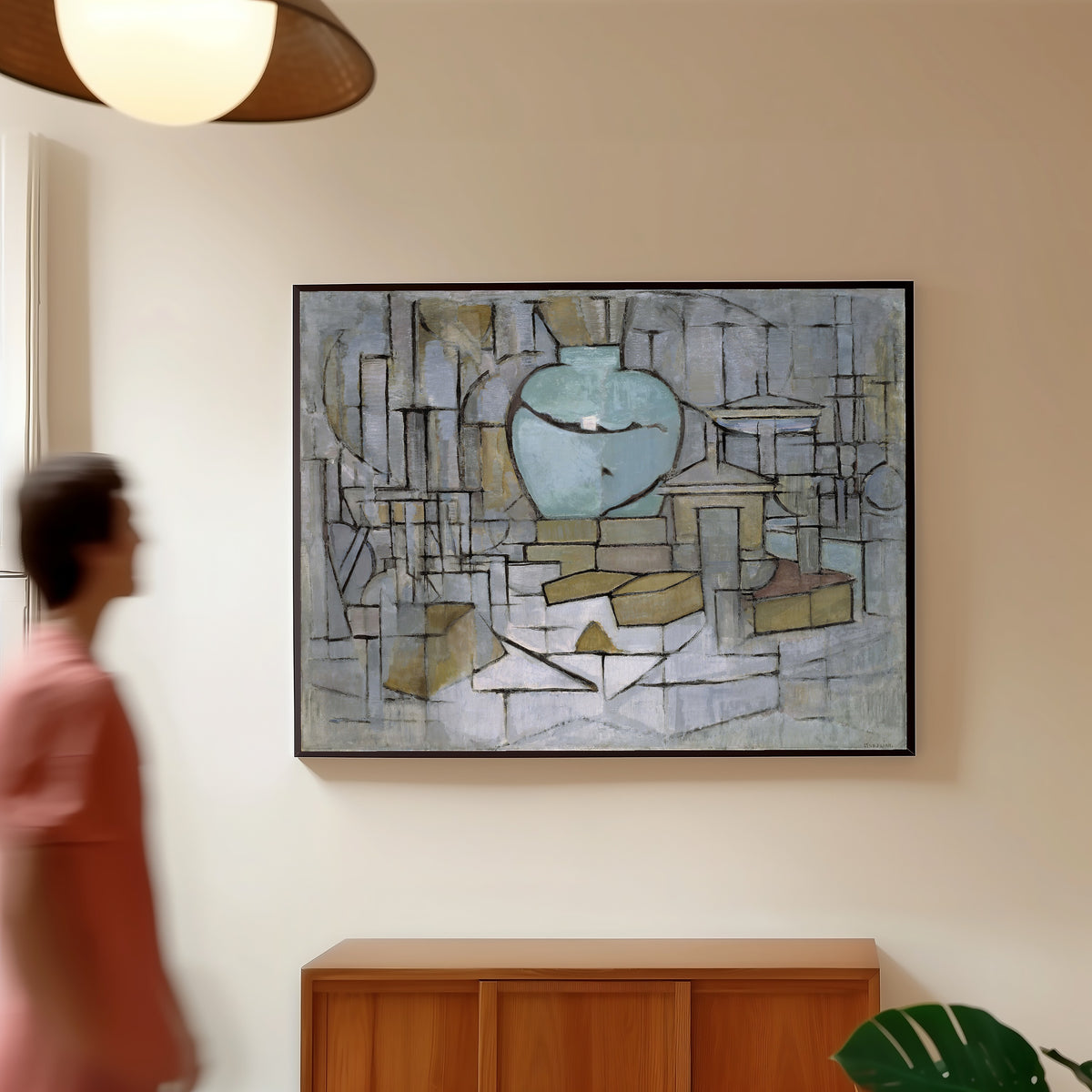 Framed art print of Still Life with Gingerpot II by Piet Mondrian, in a slim black frame on a warm wall in a sunlit room