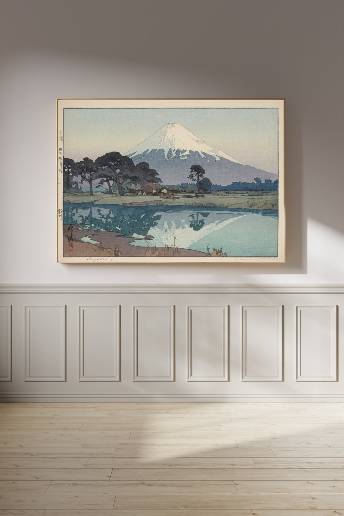 Framed art print of Suzukawa by Hiroshi Yoshida, on a panelled wall in afternoon light