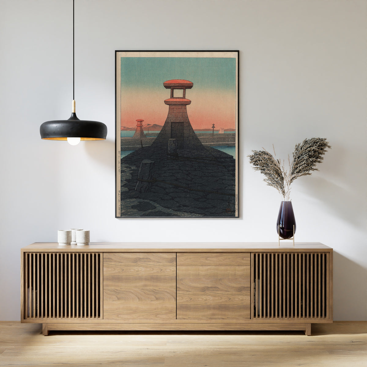 Framed art print of Tadotsu, Sanshu by Kawase Hasui, above a slatted wood sideboard