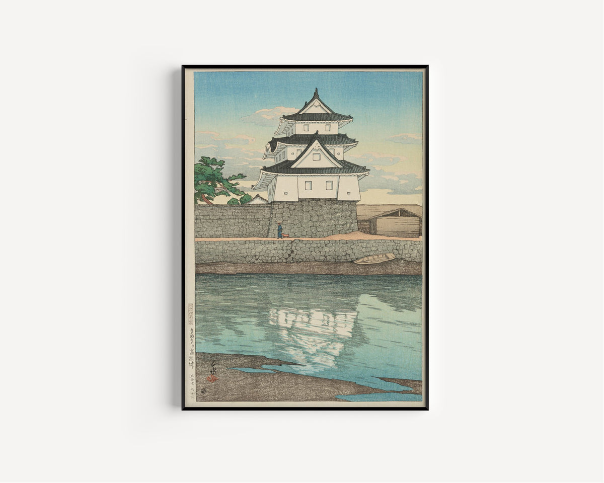 Framed art print of Takamatsu Castle in Sanuki by Kawase Hasui, in a slim black frame on a plain white wall