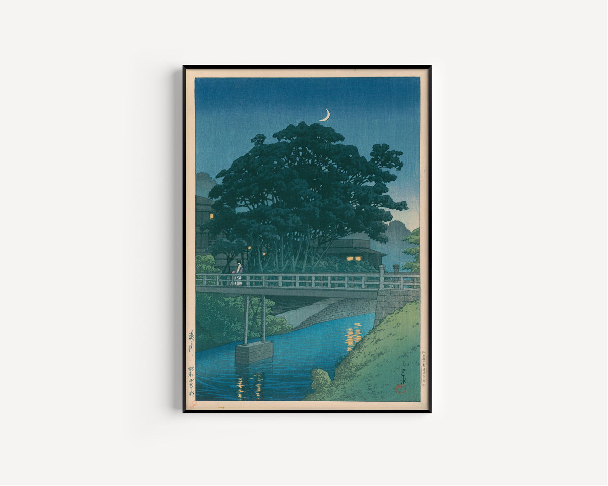 Framed art print of Takinogawa River by Kawase Hasui, in a slim black frame on a plain white wall