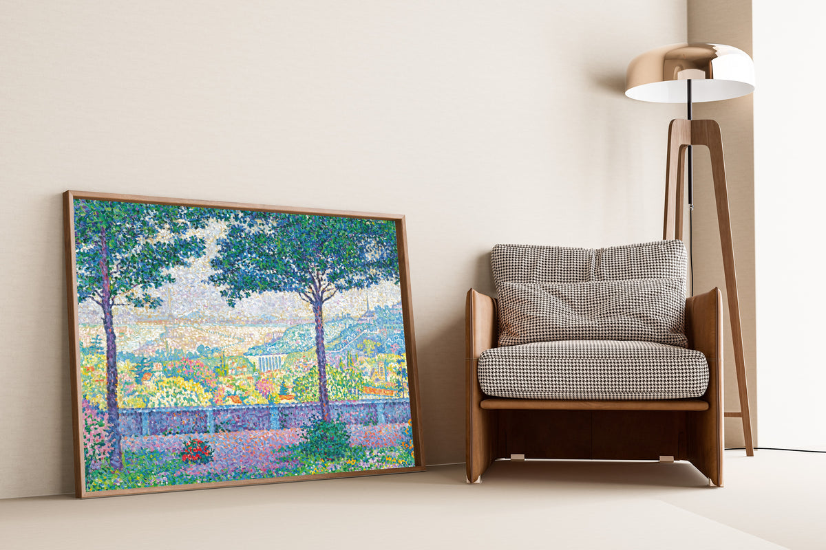 Framed art print of Terrace at Meudon by Paul Signac, leaning against a wall beside an armchair and a floor lamp