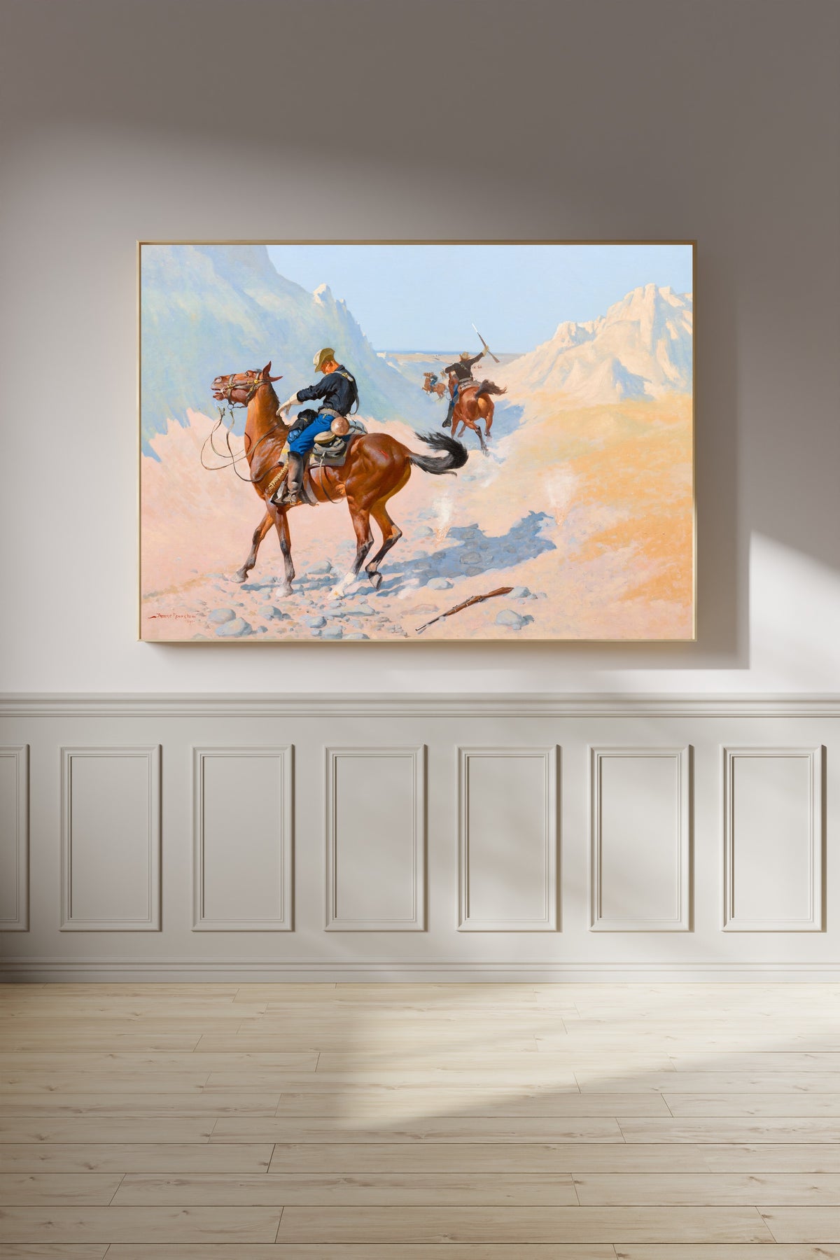 The Advance-Guard, or The Military Sacrifice by Frederic Remington — framed on a panelled wall in afternoon light