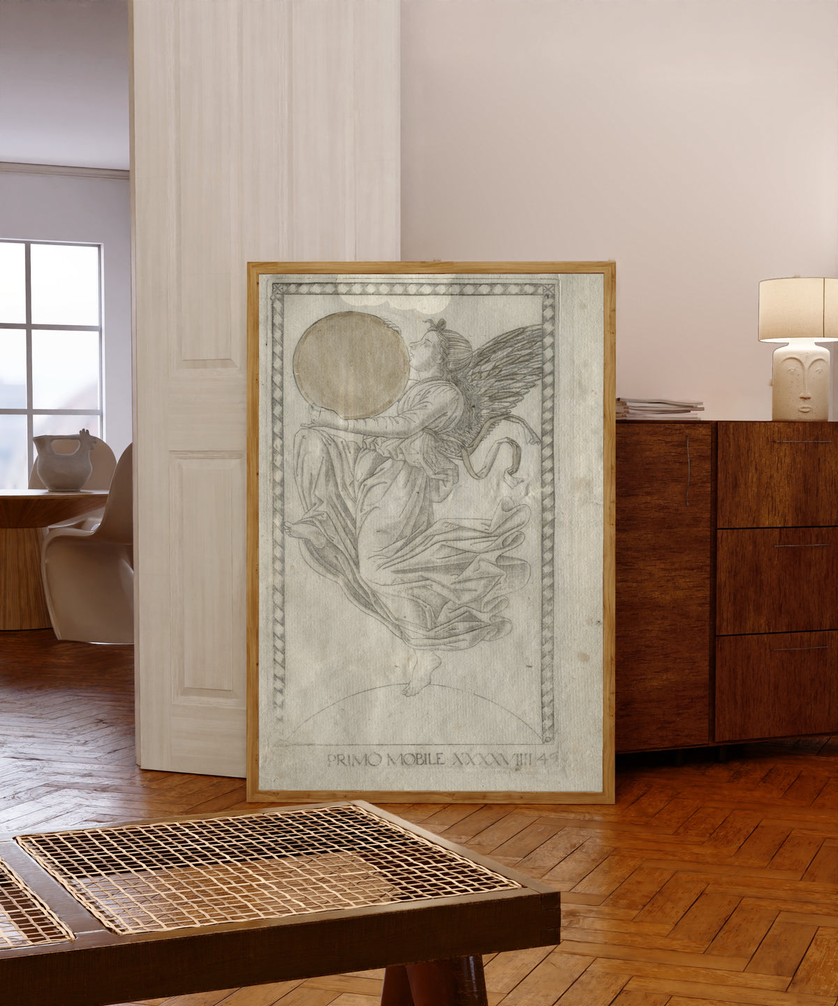 Framed art print of The Angel of the Ninth Sphere (from… by Master of the E-Series Tarocchi, in a light wood frame leaning in a warm room with a parquet floor