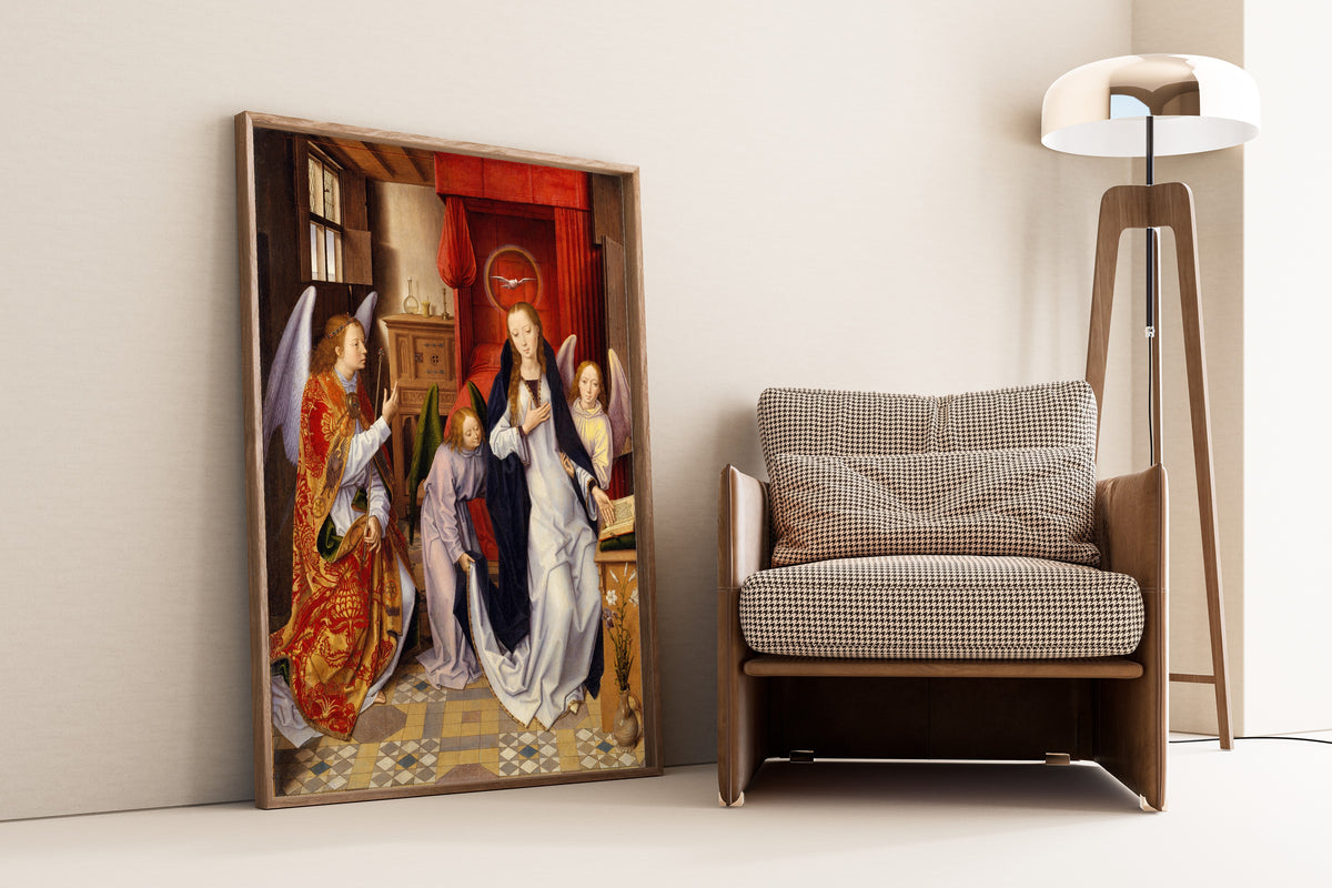 Framed art print of The Annunciation by Hans Memling, leaning against a wall beside an armchair and a floor lamp