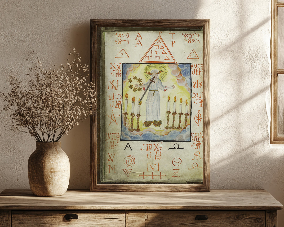 Framed art print of The Archangel Metraton, from Cyprianus by Unknown artist, in a dark wood frame leaning on a rustic console beside dried flowers
