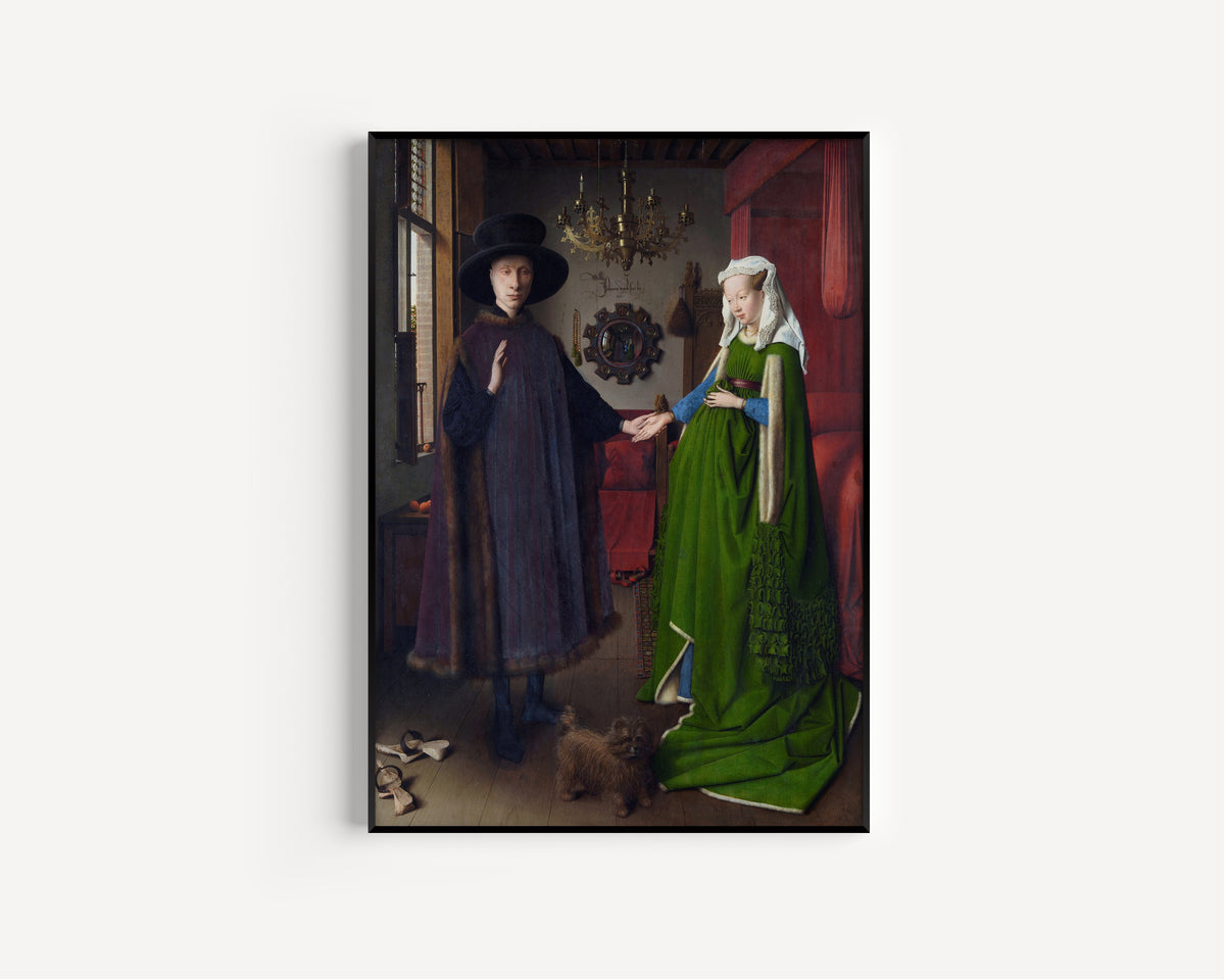 Framed art print of The Arnolfini Portrait by Jan van Eyck, in a slim black frame on a plain white wall