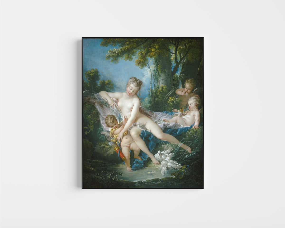 Framed art print of The Bath of Venus by François Boucher, in a slim black frame on a plain white wall