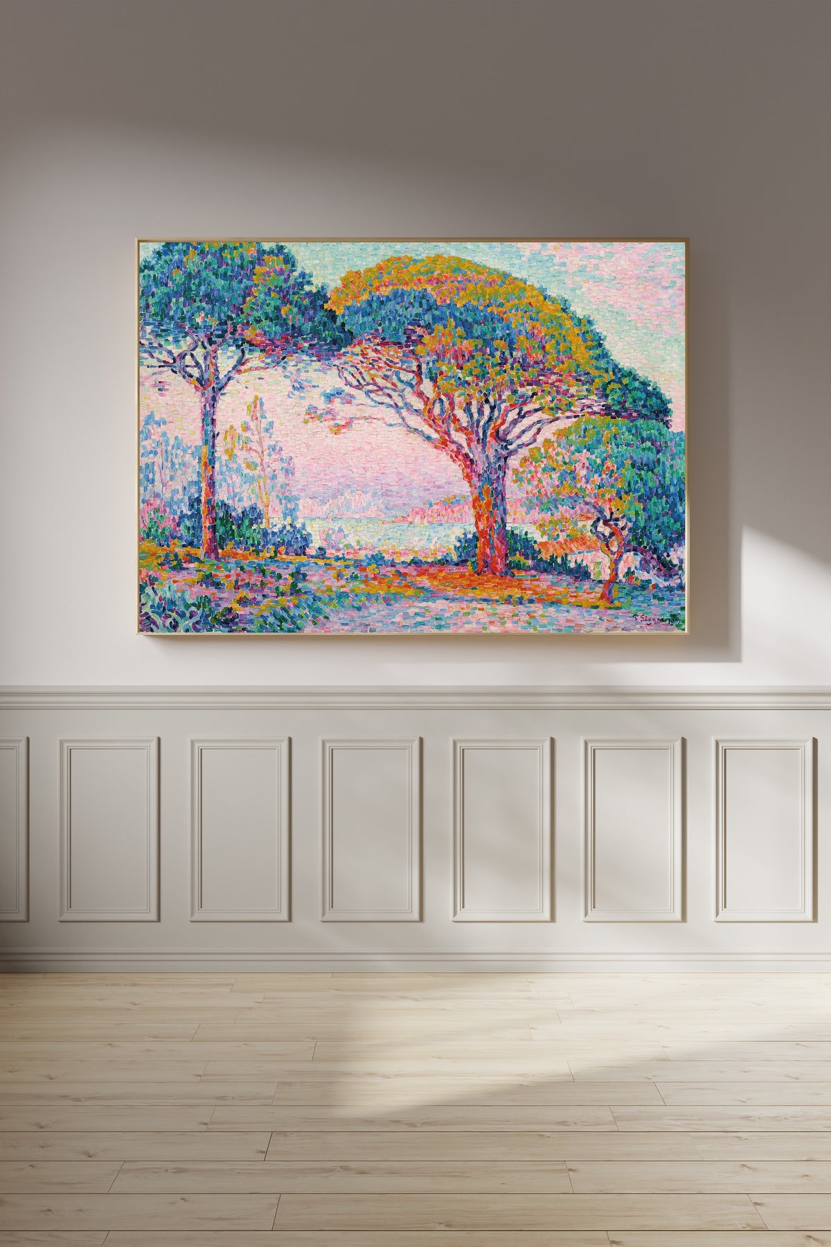 Framed art print of The Bay, Saint-Tropez by Paul Signac, on a panelled wall in afternoon light