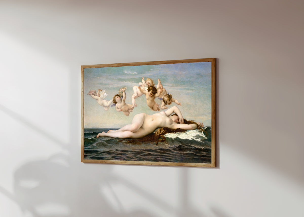 Framed art print of The Birth of Venus by Alexandre Cabanel, in a light wood frame on a sunlit white wall, seen at a slight angle
