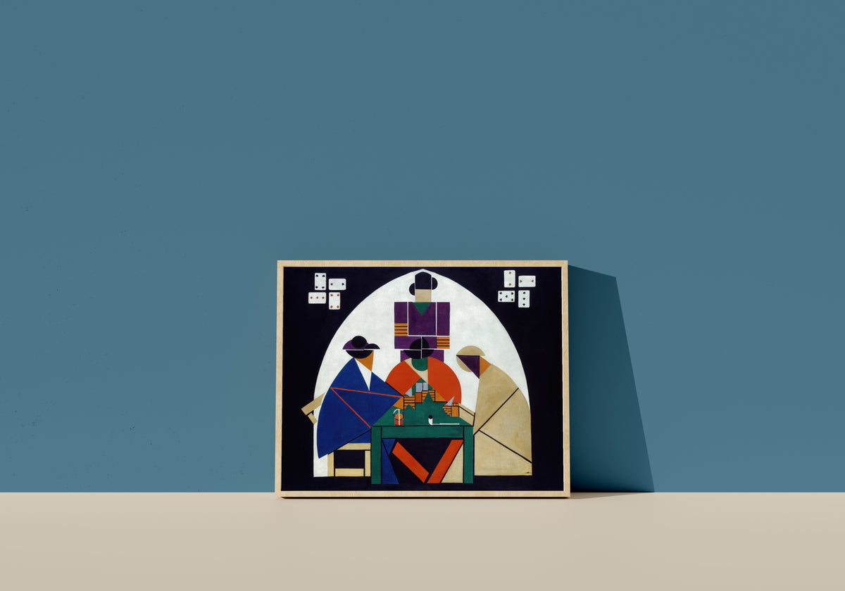 Framed art print of The Cardplayers by Theo van Doesburg, in a light wood frame leaning on a blue wall