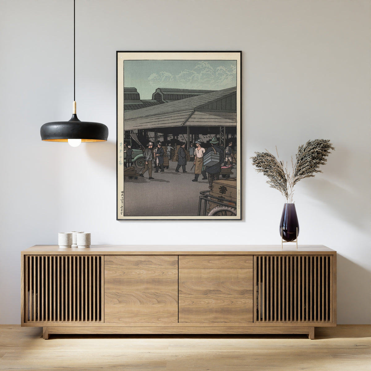 Framed art print of The Central Market by Kawase Hasui, above a slatted wood sideboard