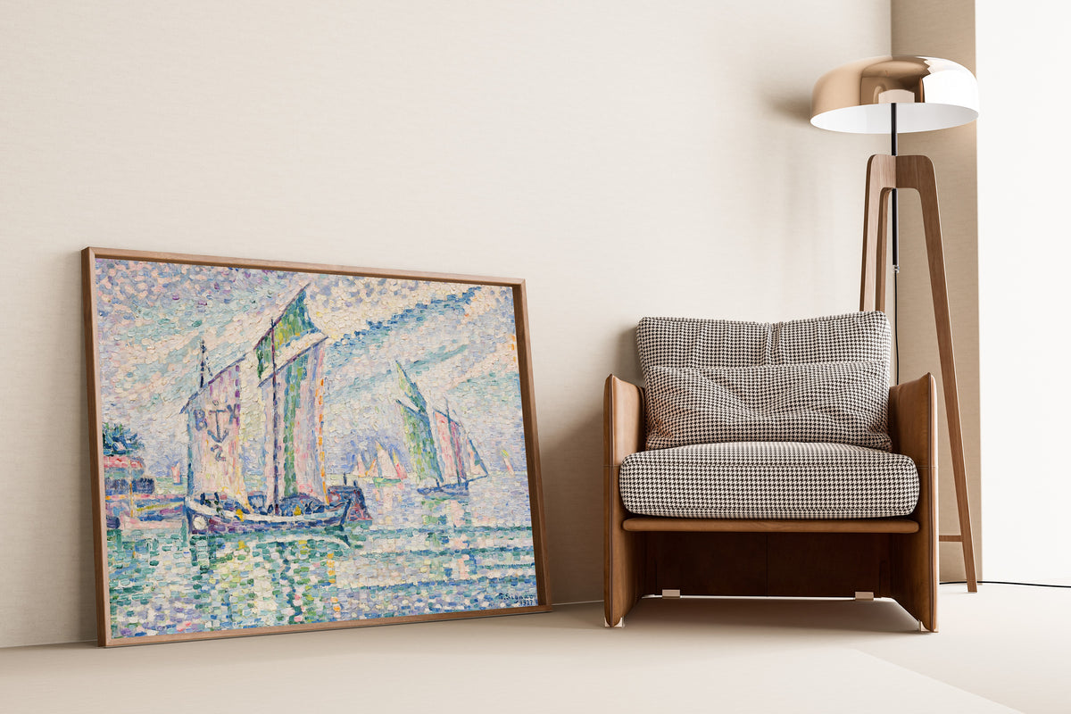 Framed art print of The Channel at La Rochelle by Paul Signac, leaning against a wall beside an armchair and a floor lamp