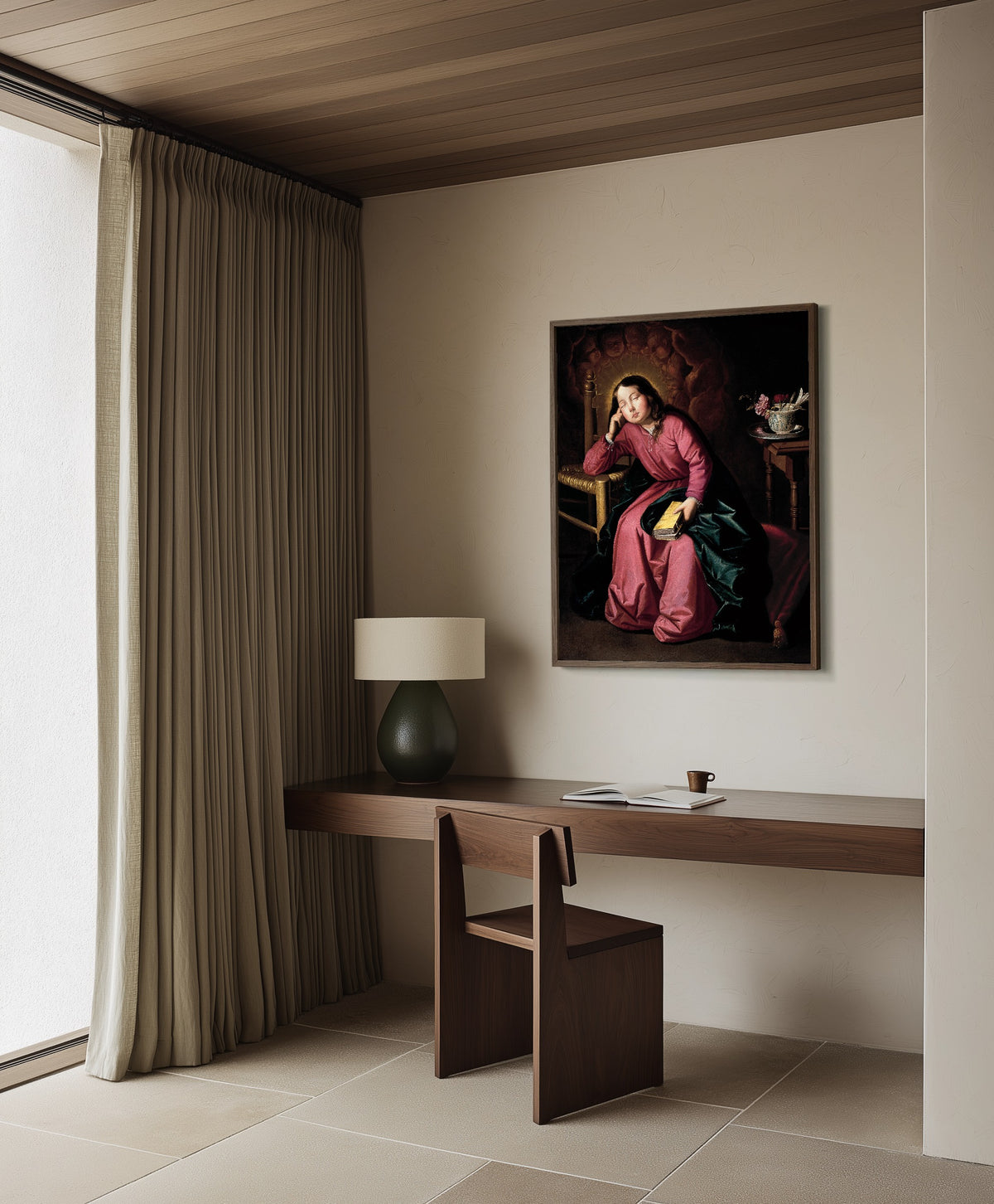 Framed art print of The Child Virgin Asleep by Francisco de Zurbarán, in a dark wood frame on a plaster wall above a walnut desk