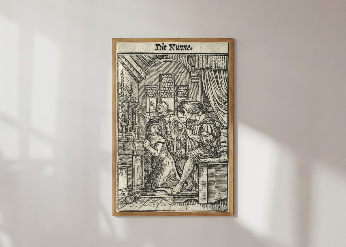 Framed art print of The Dance of Death: Die Nunne (The Nun) by Hans Holbein the Younger, in a light wood frame on a sunlit white wall