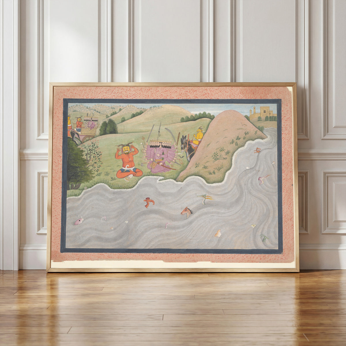 Framed art print of The Demon Marichi Tries to Dissuade Ravana by Kangra school, in a light wood frame leaning against a panelled white wall