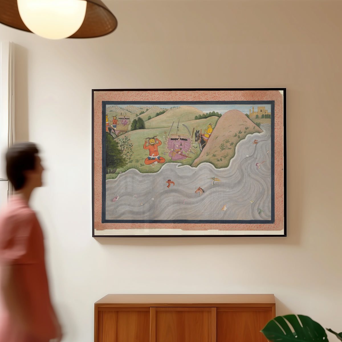 Framed art print of The Demon Marichi Tries to Dissuade Ravana by Kangra school, in a slim black frame on a warm wall in a sunlit room