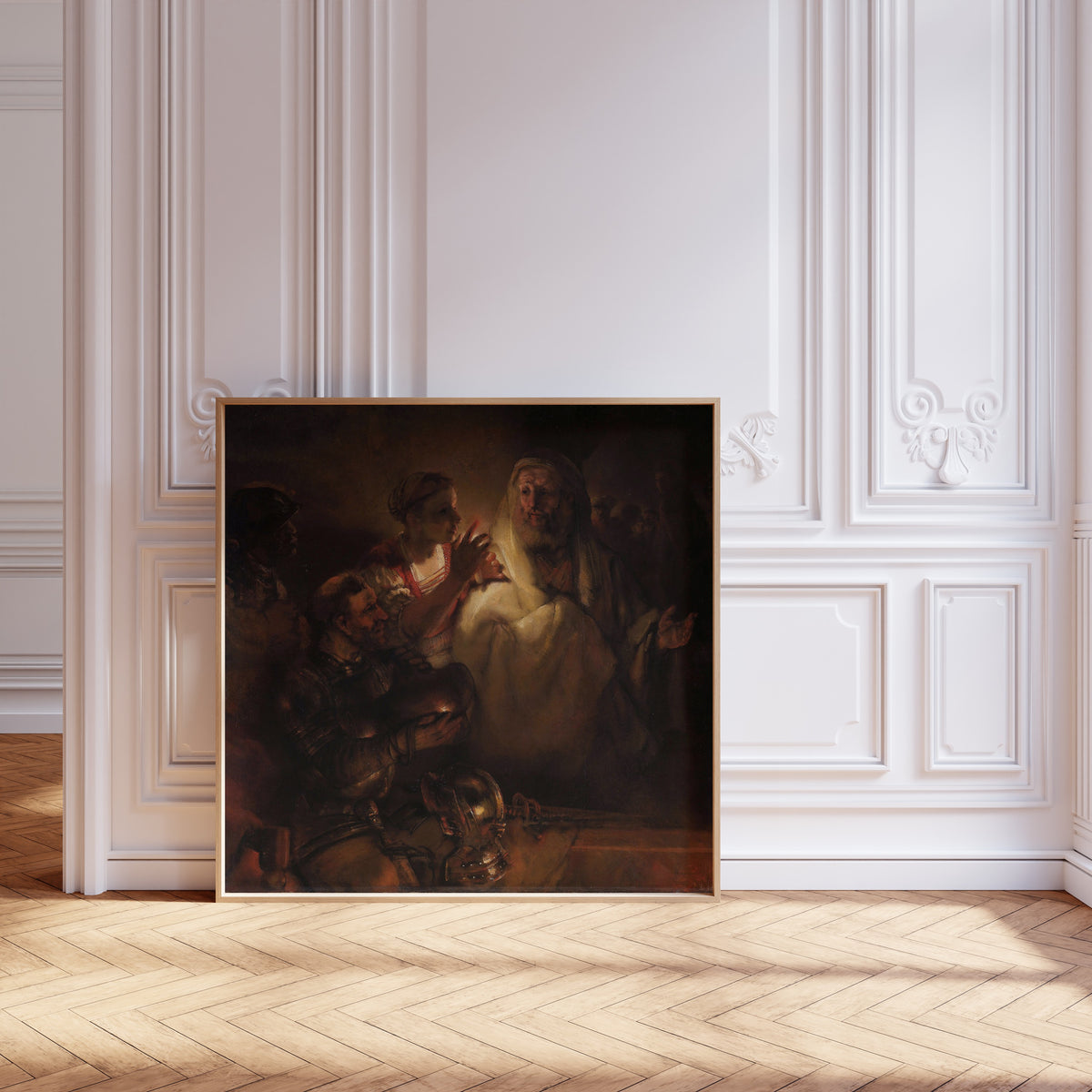 Framed art print of The Denial of St Peter by Rembrandt van Rijn, leaning against pale pink panelling on a herringbone floor