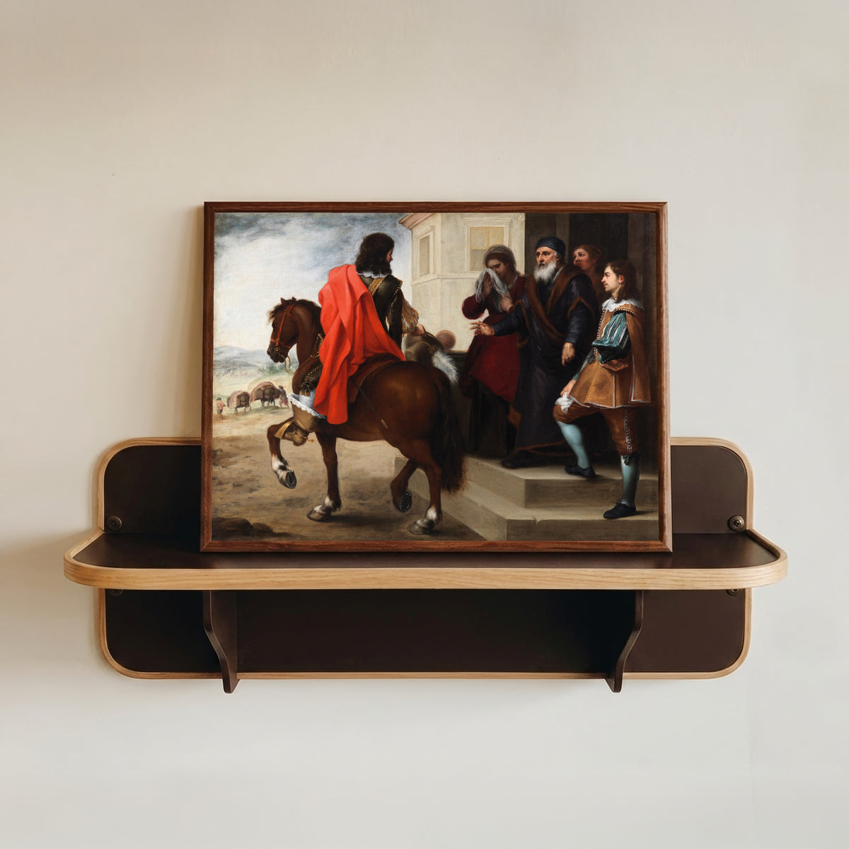 Framed art print of The Departure of the Prodigal Son by Bartolomé Esteban Murillo, in a dark wood frame resting on a wall shelf