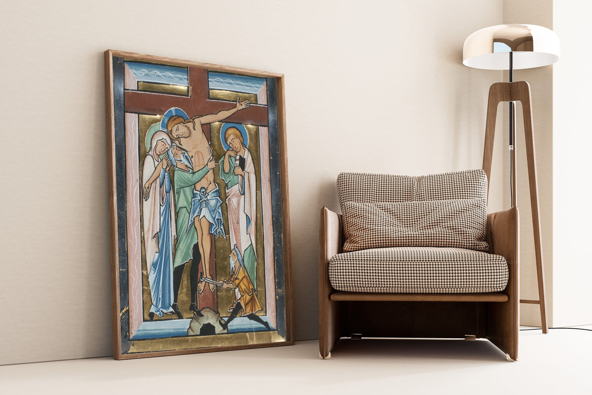 Framed art print of The Deposition, leaning against a wall beside an armchair and a floor lamp