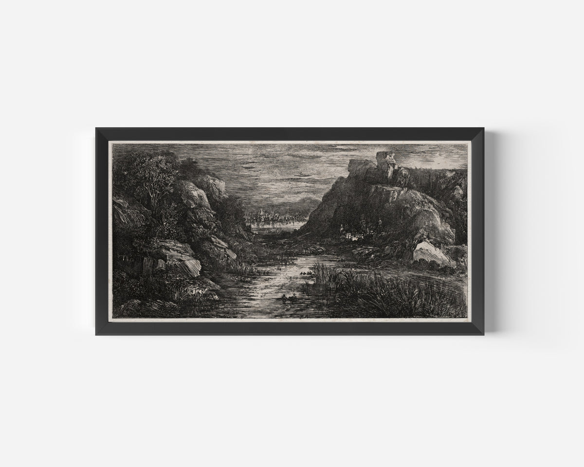 Framed art print of The Distant City by Rodolphe Bresdin, in a wide black frame on a plain white wall
