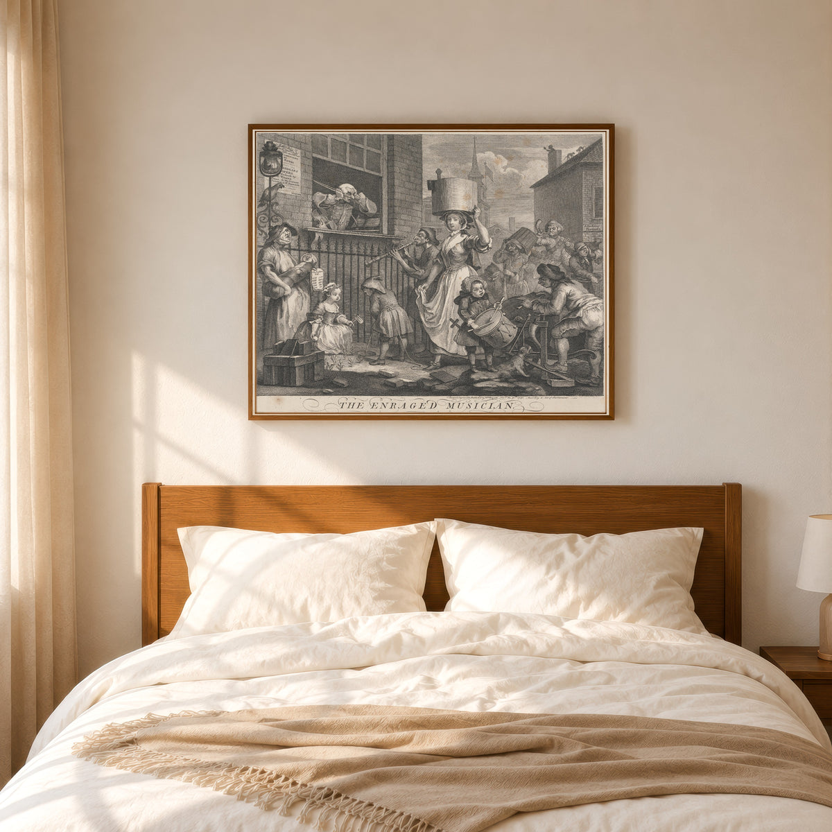 Framed art print of The Enraged Musician by William Hogarth, in a slim wood frame above a bed in a sunlit bedroom