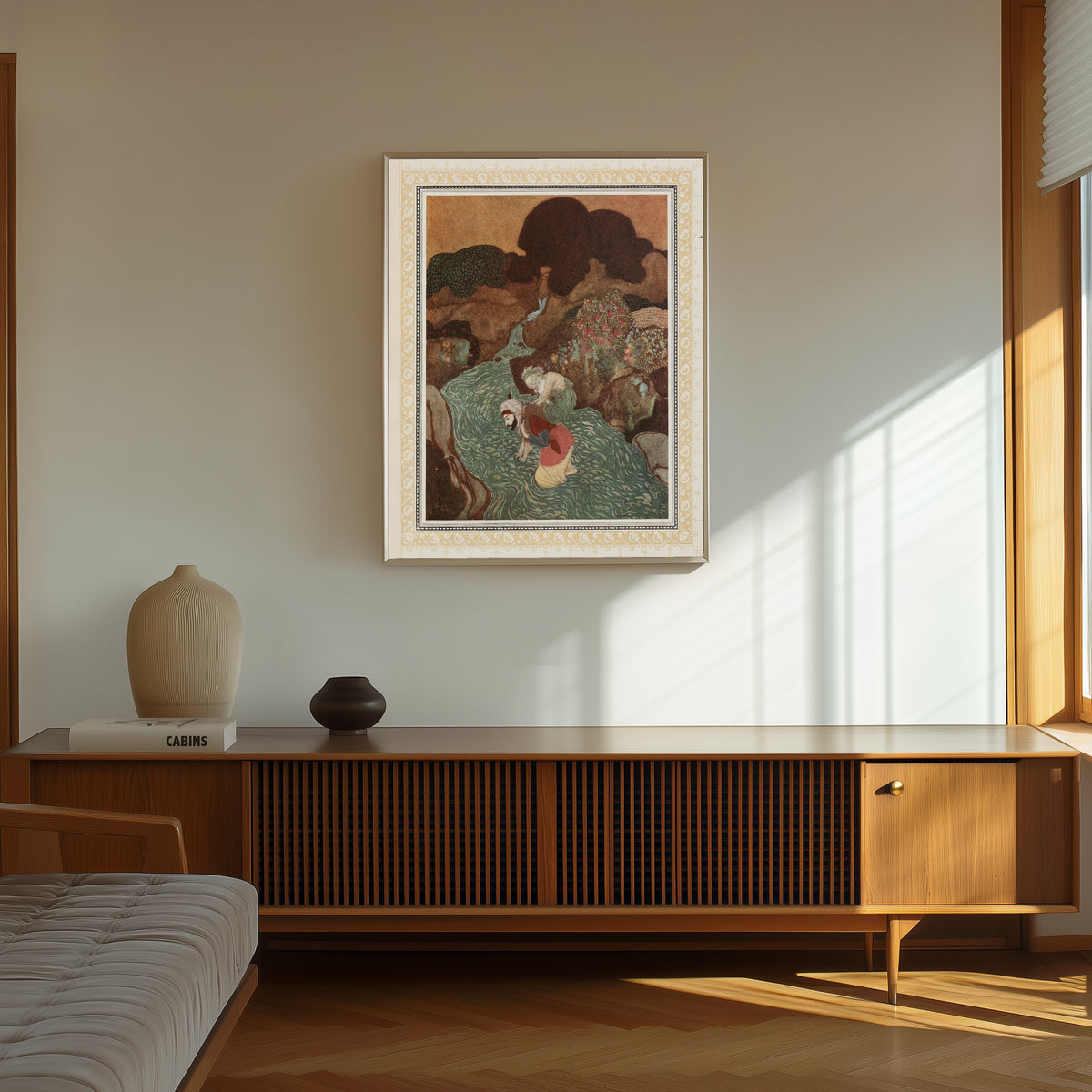 Framed art print of The Episode of the Old Man of the Sea by Edmund Dulac, in a thin light frame on a sunlit wall above a wooden sideboard