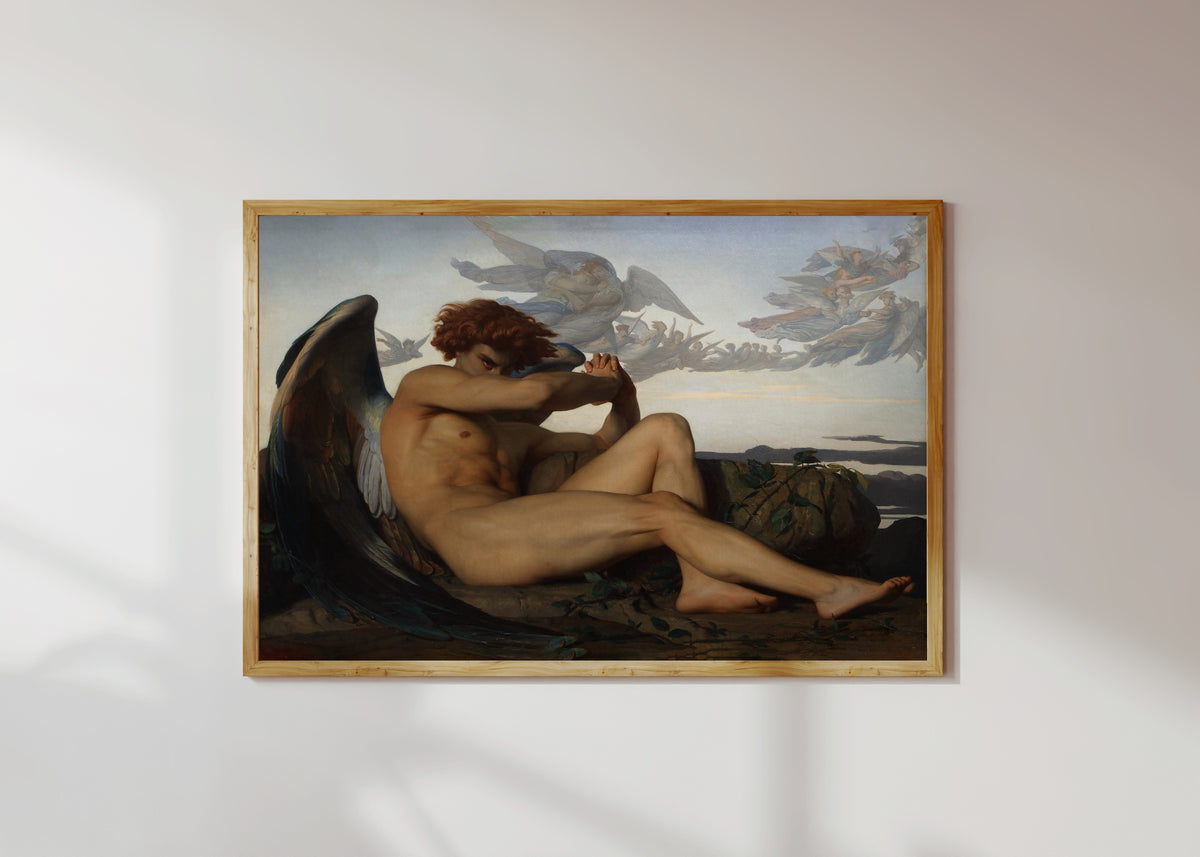 Framed art print of The Fallen Angel by Alexandre Cabanel, in a light wood frame on a sunlit white wall
