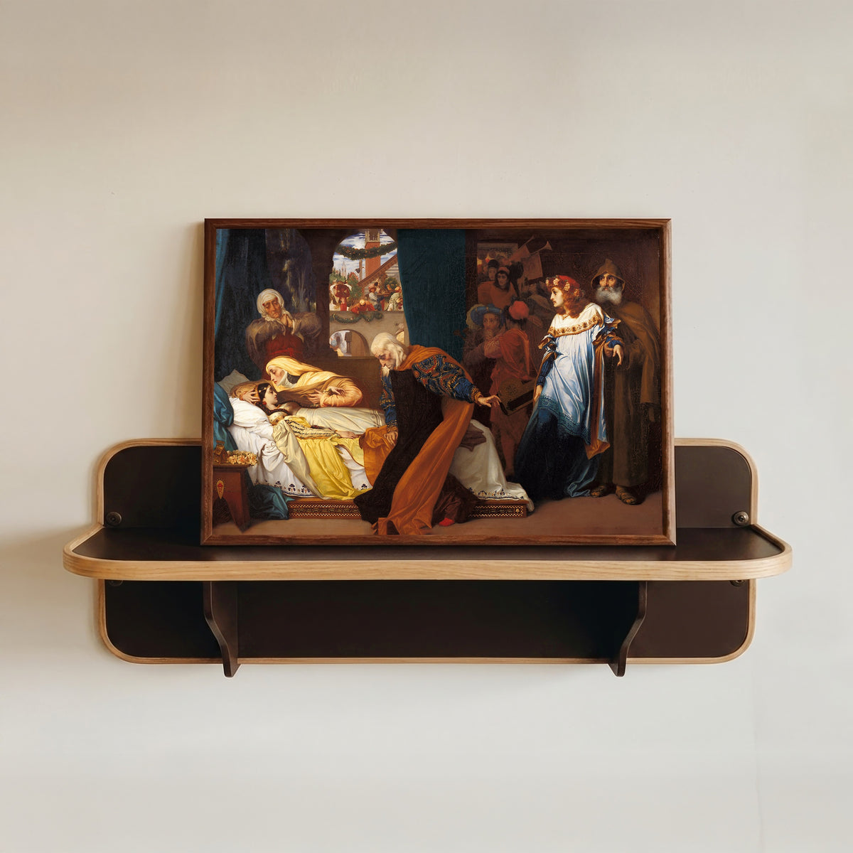 Framed art print of The Feigned Death of Juliet by Frederic Leighton, in a dark wood frame resting on a wall shelf