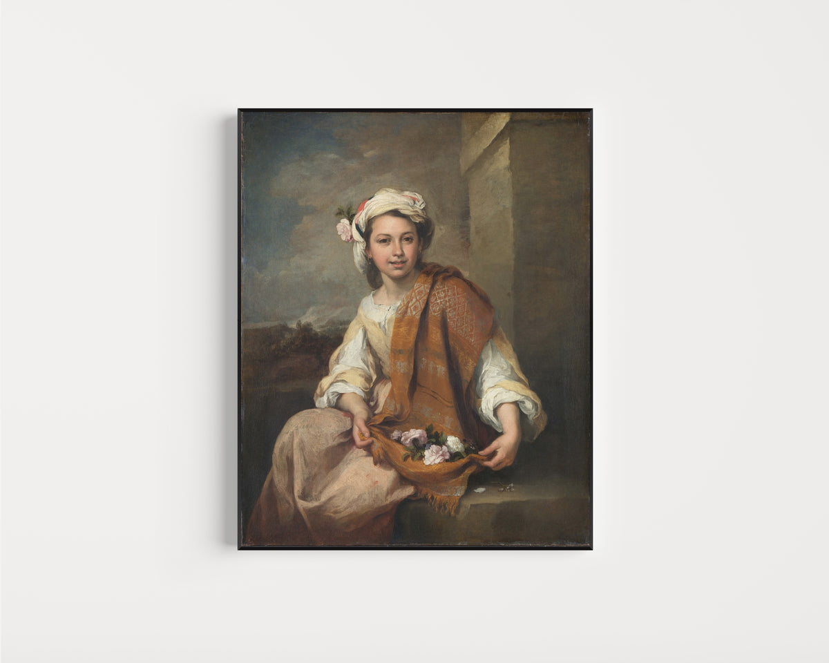 Framed art print of The Flower Girl by Bartolomé Esteban Murillo, in a slim black frame on a plain white wall