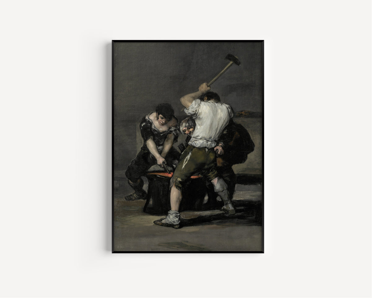 Framed art print of The Forge by Francisco de Goya, in a slim black frame on a plain white wall