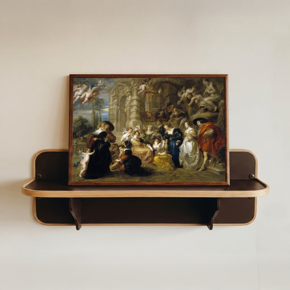 Framed art print of The Garden of Love by Peter Paul Rubens, in a dark wood frame resting on a wall shelf