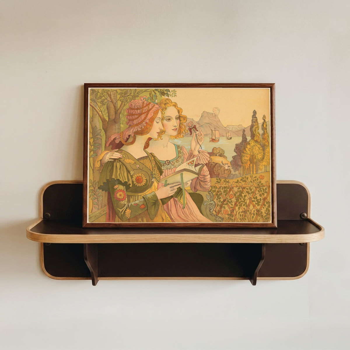 Framed art print of The Golden Legend by Armand Point, in a dark wood frame resting on a wall shelf