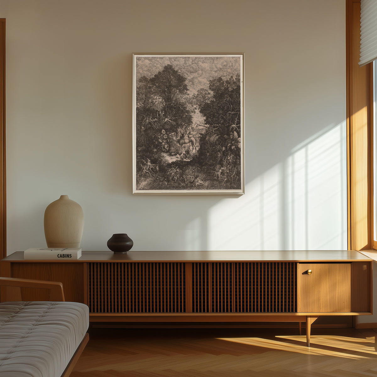 Framed art print of The Good Samaritan by Rodolphe Bresdin, in a thin light frame on a sunlit wall above a wooden sideboard