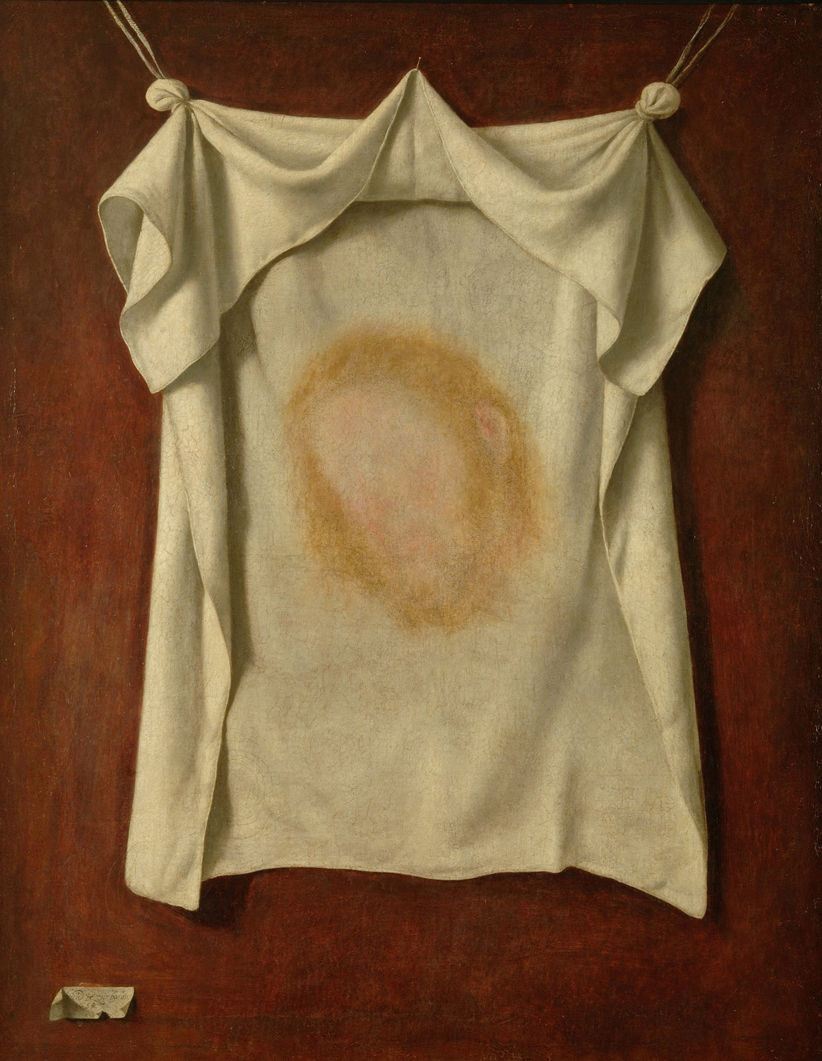 The Holy Face by Francisco de Zurbarán — A white cloth hanging on cords, with a faint face upon it