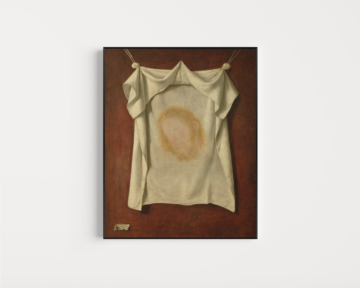 Framed art print of The Holy Face by Francisco de Zurbarán, in a slim black frame on a plain white wall