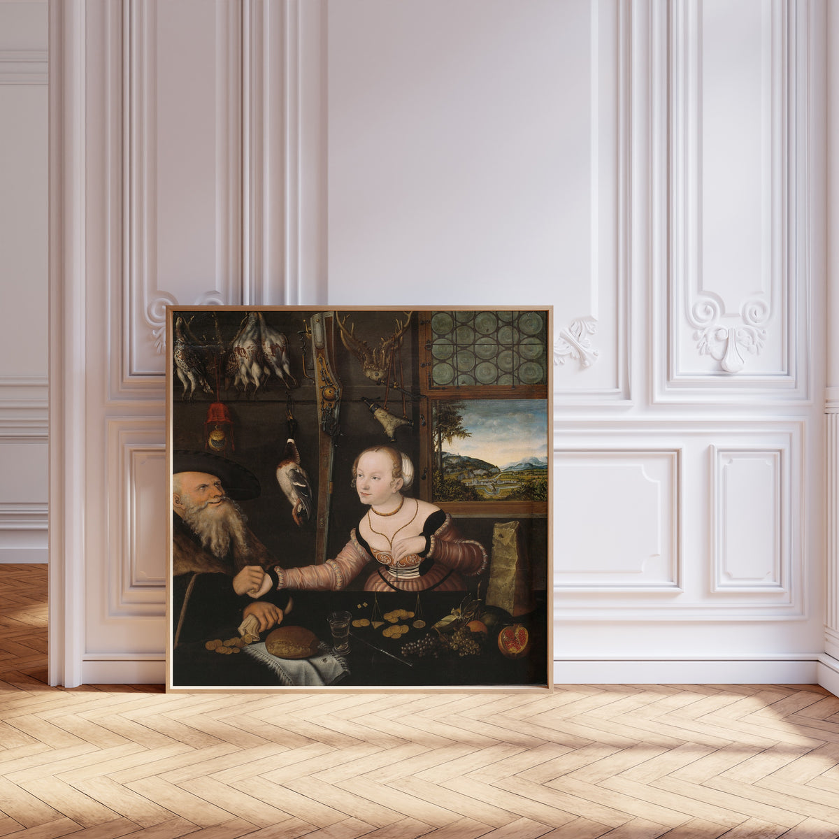 Framed art print of The Ill-matched Couple by Lucas Cranach the Elder, leaning against pale pink panelling on a herringbone floor