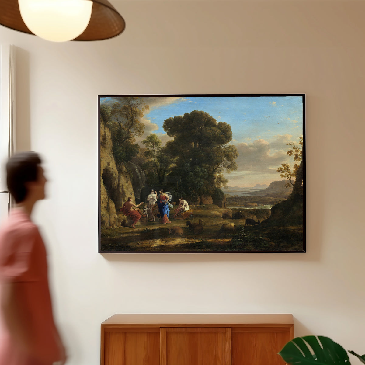 Framed art print of The Judgment of Paris by Claude Lorrain, in a slim black frame on a warm wall in a sunlit room