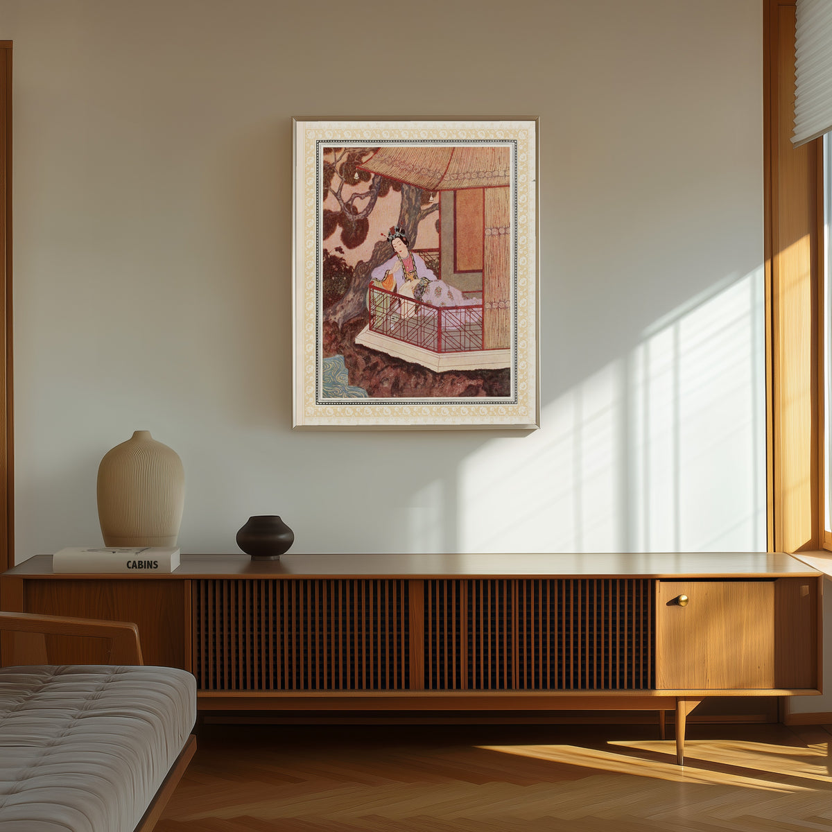 Framed art print of The Lady Bedr-el-Budur by Edmund Dulac, in a thin light frame on a sunlit wall above a wooden sideboard