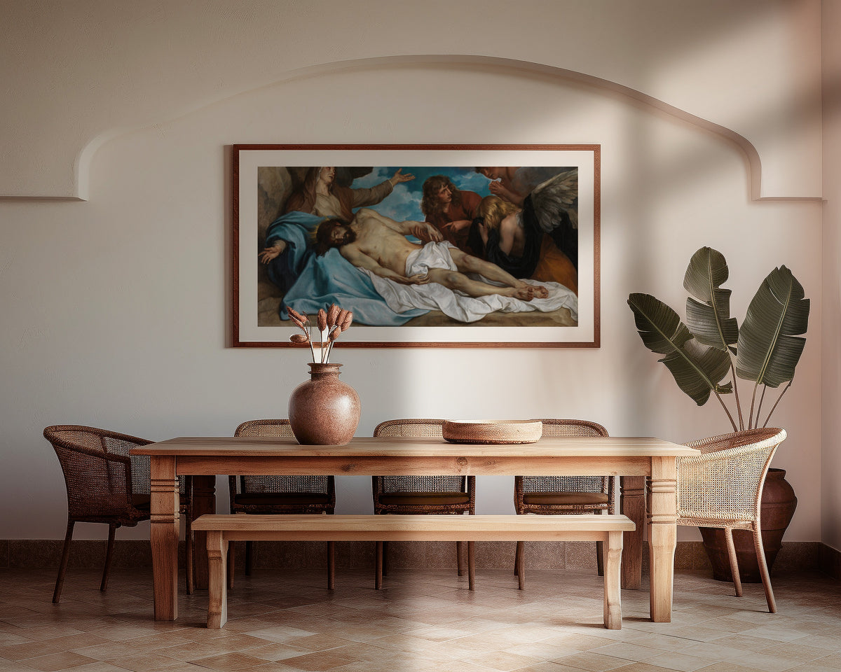 Framed art print of The Lamentation over the Dead Christ by Anthony van Dyck, above a wooden dining table