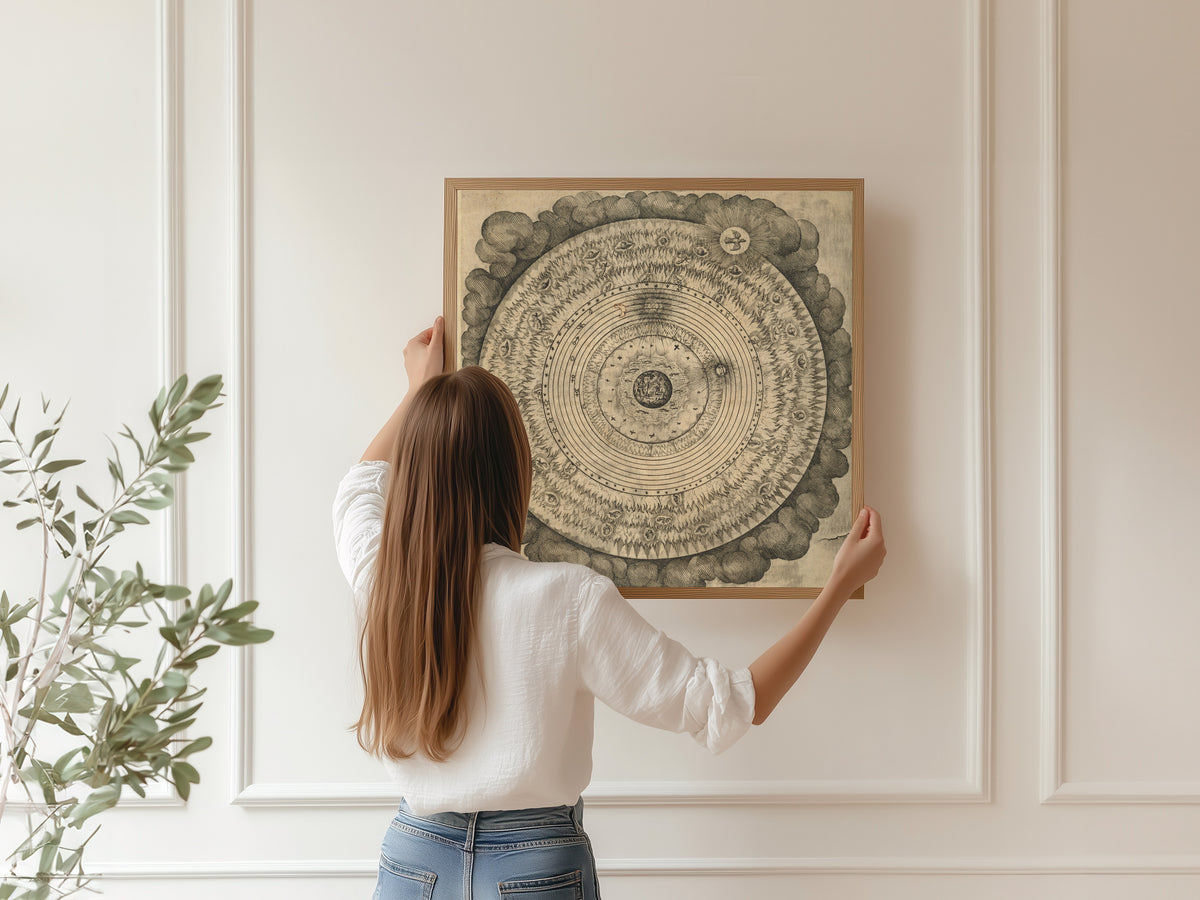 Framed art print of The Macrocosm: Concentric Spheres in Clouds (Utriusque Cosmi, Tractatus Primus) by Robert Fludd, hung on a panelled wall