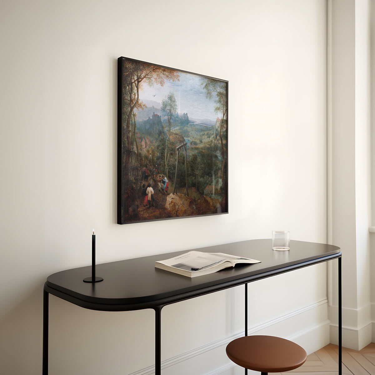 Framed art print of The Magpie on the Gallows by Pieter Bruegel the Elder, above a slim black console table