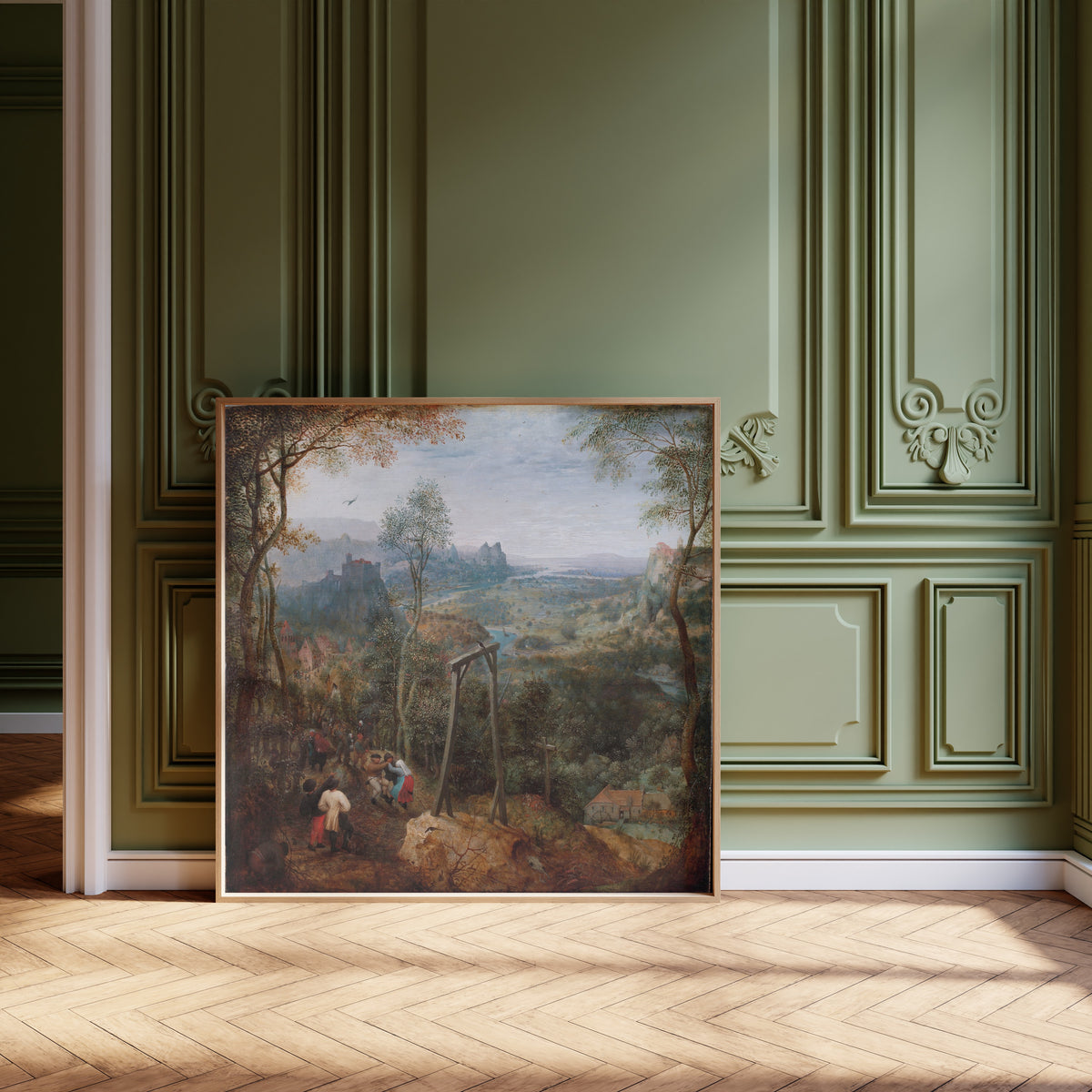 Framed art print of The Magpie on the Gallows by Pieter Bruegel the Elder, leaning against olive-green panelling on a herringbone floor