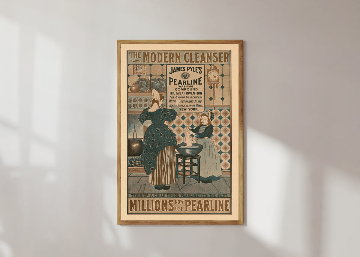 Framed art print of The Modern Cleanser, Millions Now Use Pearline by Louis Rhead, in a light wood frame on a sunlit white wall