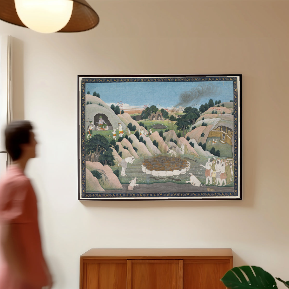 Framed art print of The Monkey King Vali's Funeral Pyre by Kangra school, in a slim black frame on a warm wall in a sunlit room