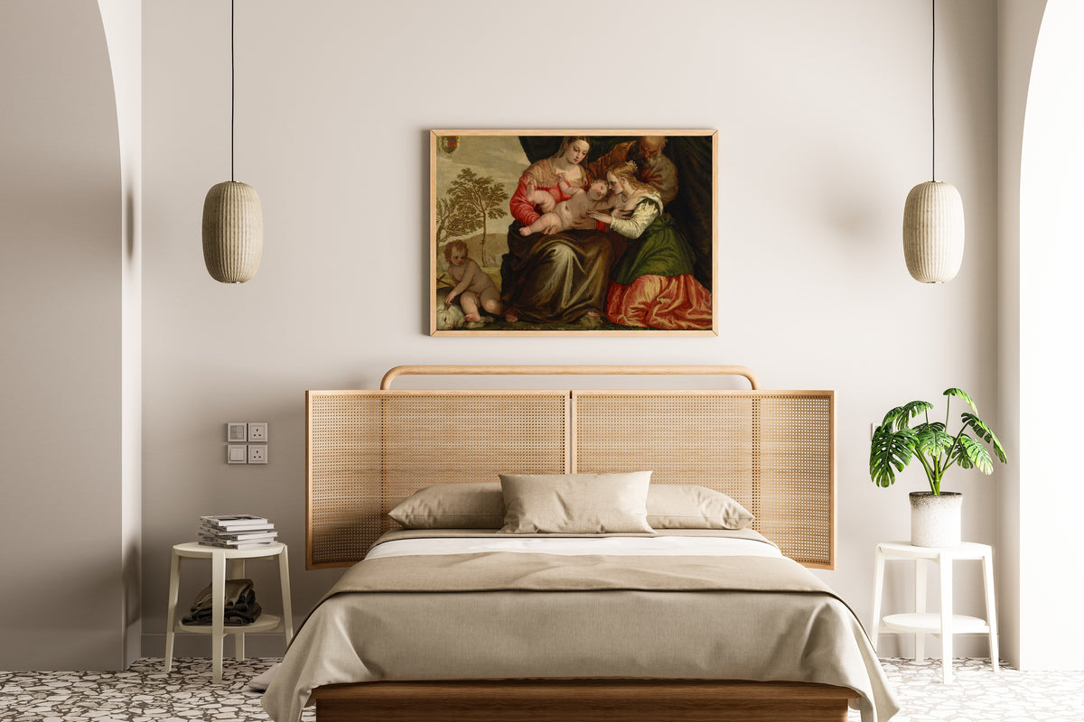 Framed art print of The Mystic Marriage of St. Catherine by Paolo Veronese, above a cane-headboard bed