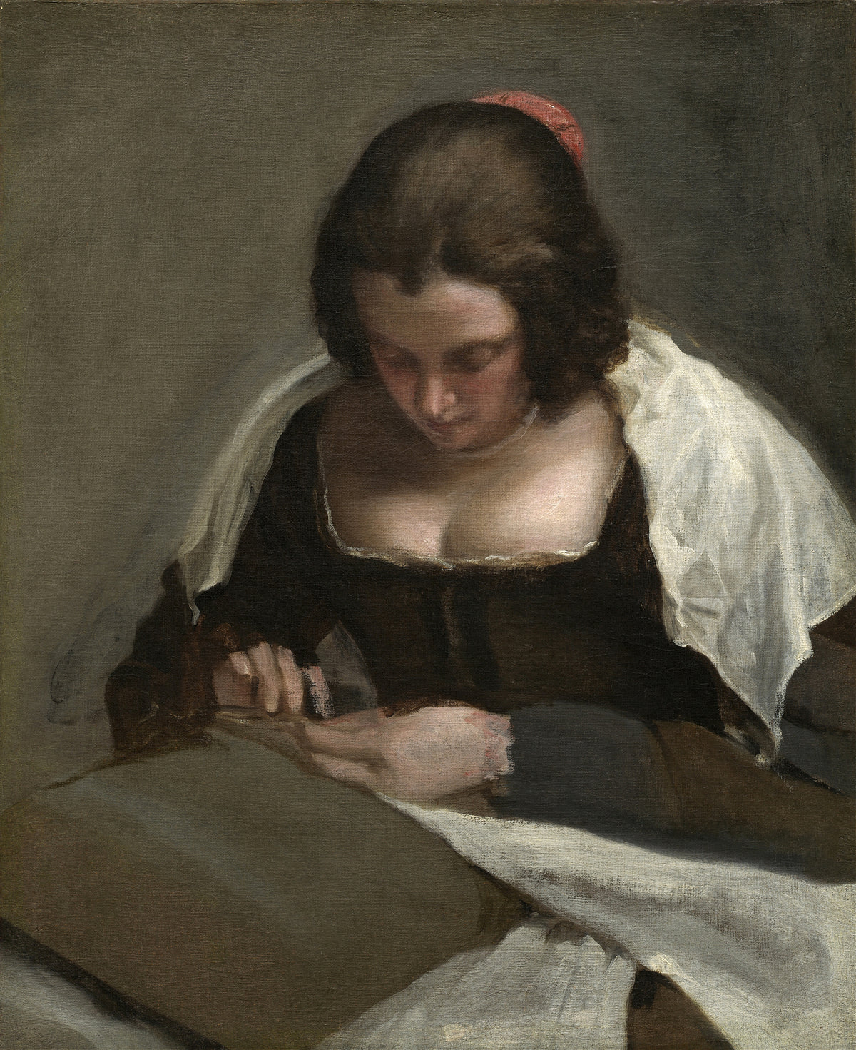 The Needlewoman by Diego Velázquez — A young woman bows her head over her sewing