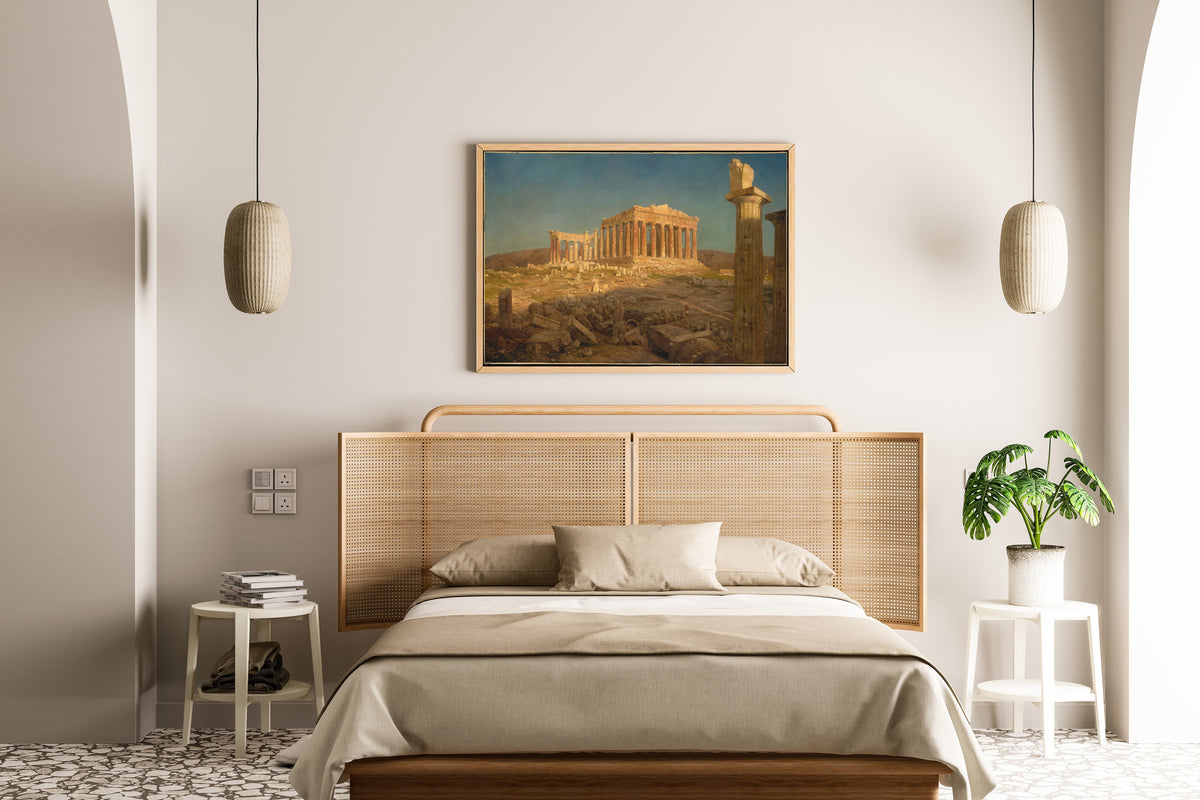 The Parthenon by Frederic Edwin Church — framed above a cane-headboard bed