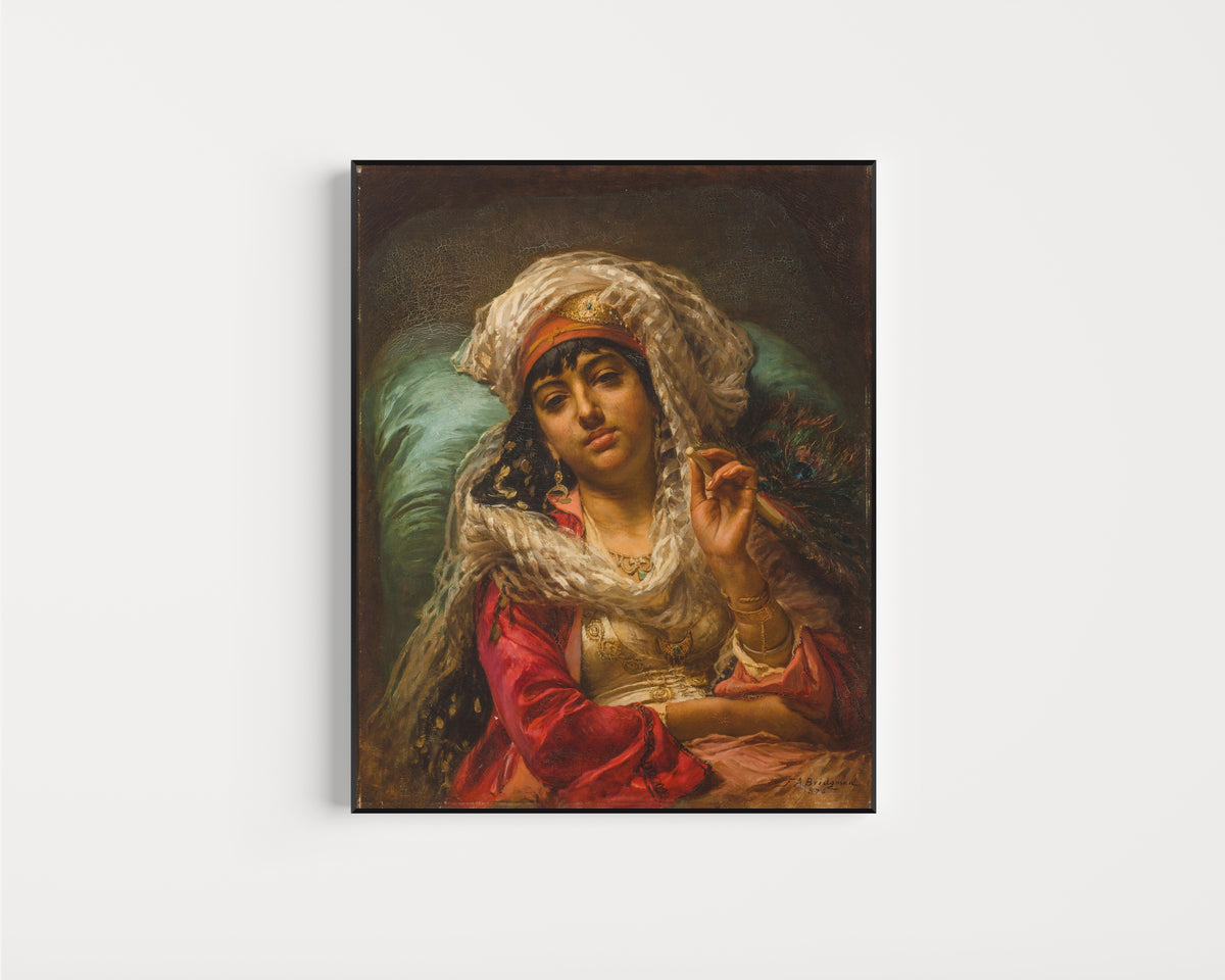 Framed art print of The Peacock Fan by Frederick Arthur Bridgman, in a slim black frame on a plain white wall